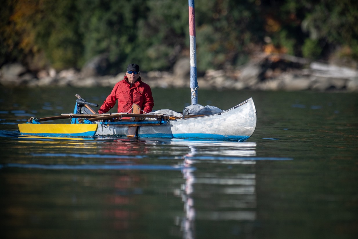 Will Thomas helming his solar-electric, outrigged sailing canoe, Electra -Don Peterson photo